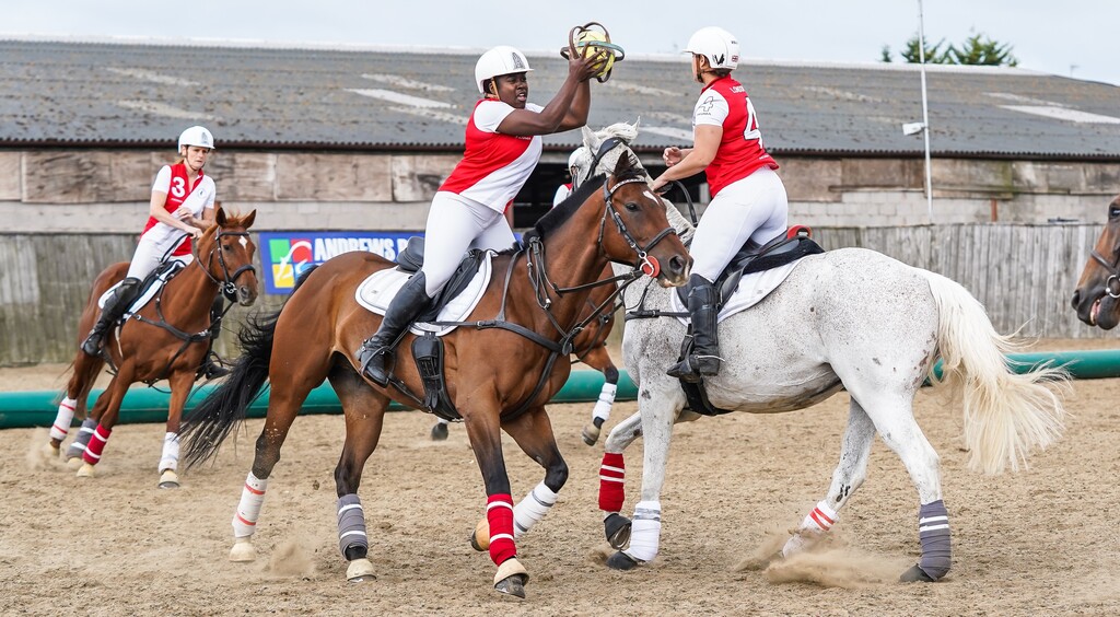 Horseball team catching the ball