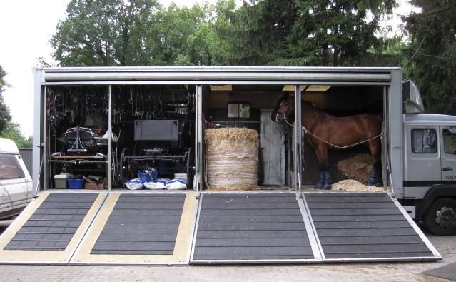 Horsebox filled with tack, hay, and a horse